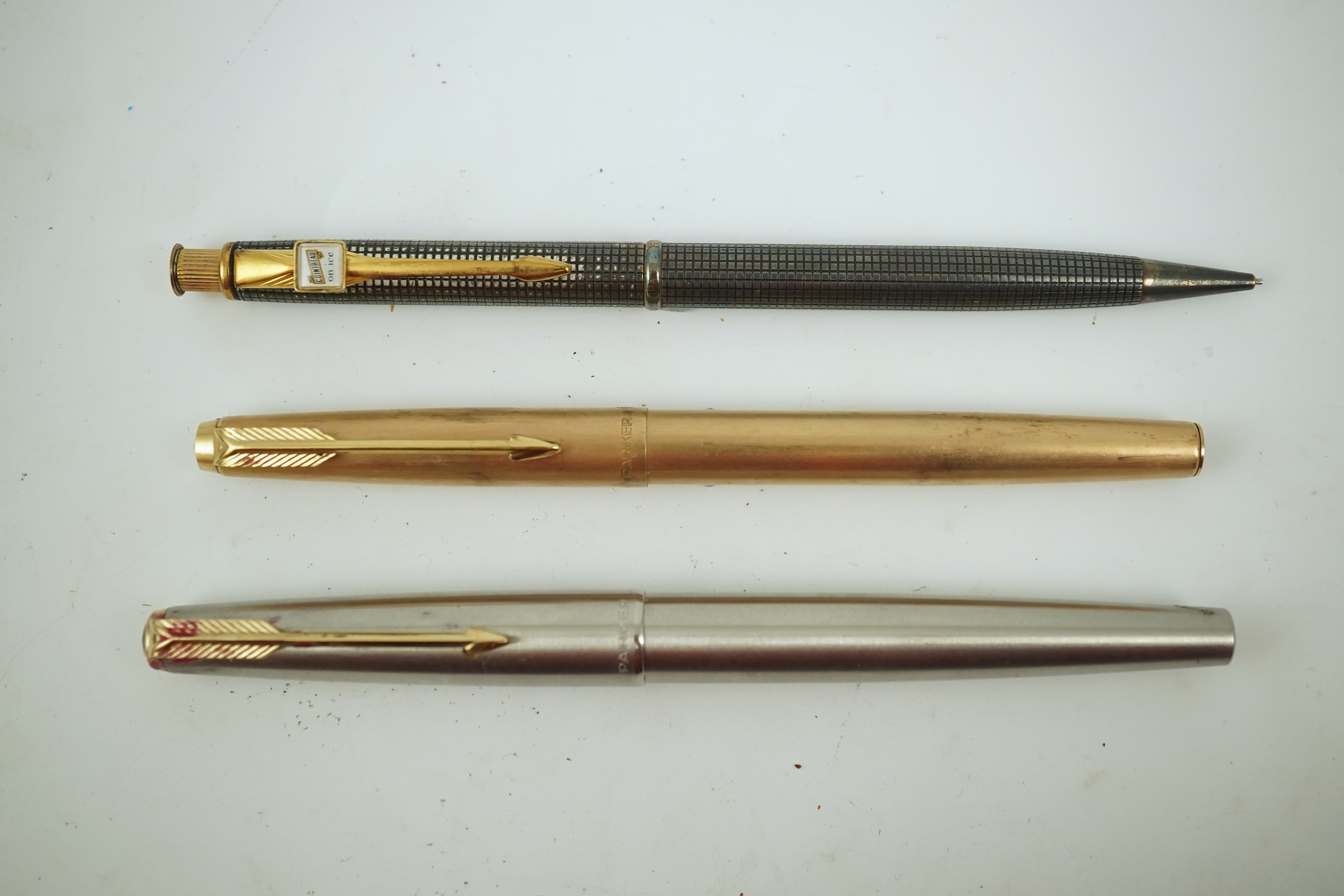 A Cross advertising propelling pencil, Cointreau on ice, a Parker felt tip cartridge pen and a cased Parker stainless steel pen. Condition - poor to fair